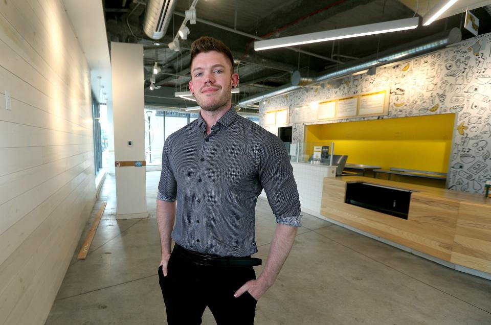 From July: Riley Dethier stands in the old Original Grain prior to remodeling the space into board game cafe Dice Versa.