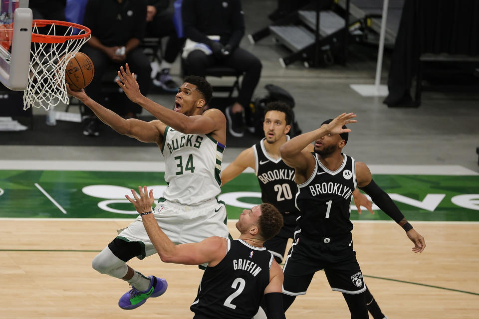 Giannis Antetokounmpo #34 of the Milwaukee Bucks drives to the basket against Blake Griffin #2 of the Brooklyn Nets during the second half of a game at Fiserv Forum on May 04, 2021 in Milwaukee, Wisconsin. NOTE TO USER: User expressly acknowledges and agrees that, by downloading and or using this photograph, User is consenting to the terms and conditions of the Getty Images License Agreement. (Photo by Stacy Revere/Getty Images)