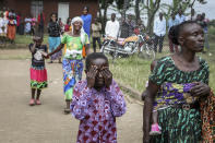 Relatives grieve as they wait to collect the bodies of villagers who were killed by suspected rebels as they retreated from Saturday's attack on the Lhubiriha Secondary School, outside the mortuary of the hospital in Bwera, Uganda Sunday, June 18, 2023. Ugandan authorities have recovered the bodies of 41 people including 38 students who were burned, shot or hacked to death after suspected rebels attacked the school in Mpondwe near the border with Congo, according to the local mayor. (AP Photo/Hajarah Nalwadda)