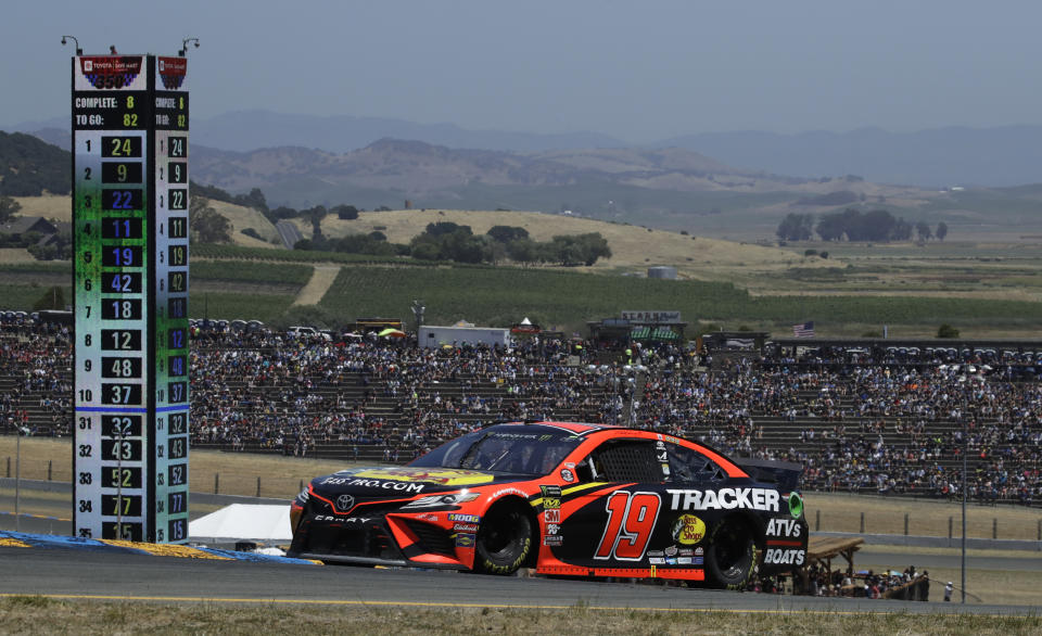 Martin Truex Jr. (19) competes during a NASCAR Sprint Cup Series auto race Sunday, June 23, 2019, in Sonoma, Calif. (AP Photo/Ben Margot)