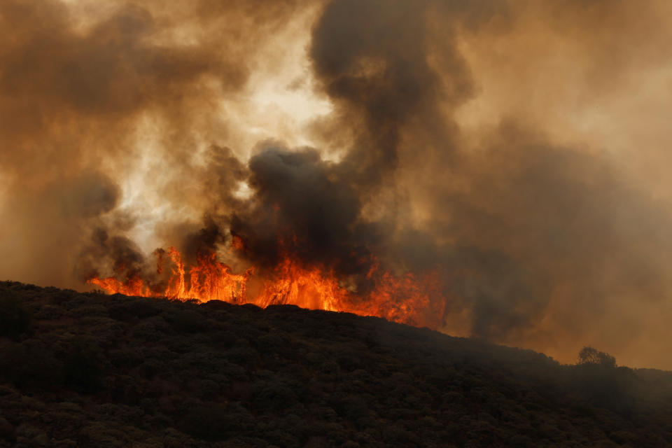 A wildfire rages, in the area of Pico de las Nieves, on the Canary Island of Gran Canaria, Spain July 25, 2023. REUTERS/Borja Suarez
