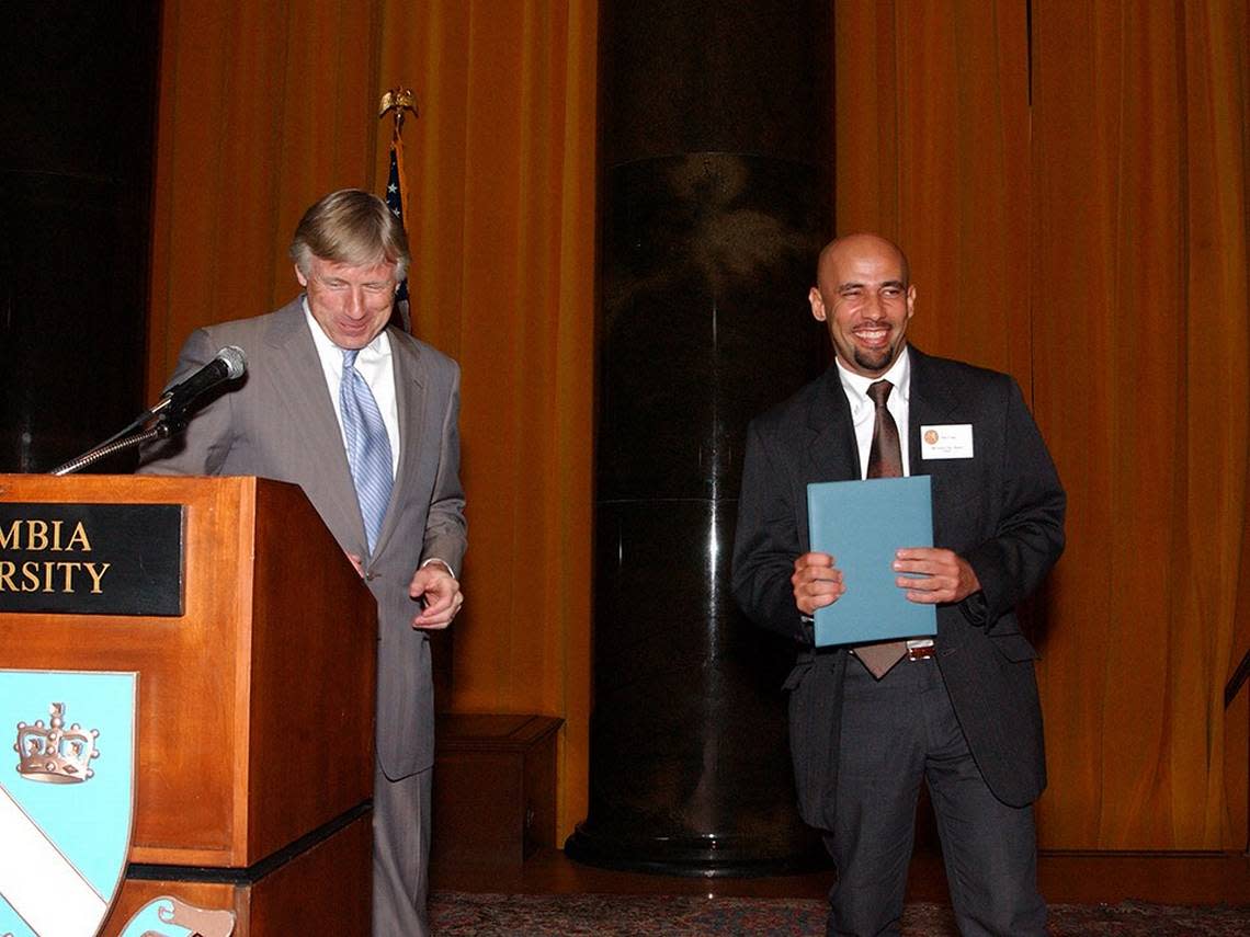 Columbia University President Lee C. Bollinger, left, presents Nilo Cruz with the 2003 Pulitzer Prize in Drama.