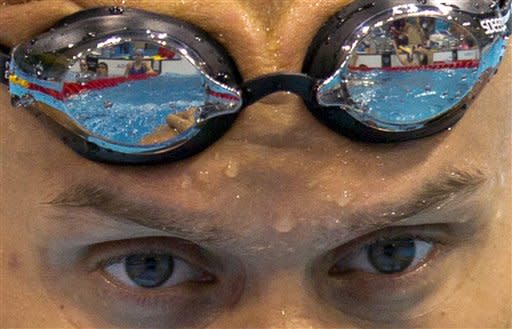 Canadian swimmer Brent Hayden does kicking drill during a training session for the London 2012 Olympics in London, Friday July 27, 2012. (AP Photo/The Canadian Press, Frank Gunn)