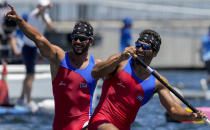 Serguey Torres Madrigal and Fernando Dayan Jorge Enriquez, of Cuba, react after competing in the men's canoe double 1000m final at the 2020 Summer Olympics, Tuesday, Aug. 3, 2021, in Tokyo, Japan. (AP Photo/Lee Jin-man)