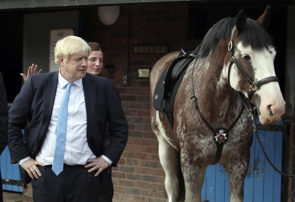 Britain's Prime Minister Boris Johnson looks on during a visit to West Yorkshire in England, Thursday, Sept. 5, 2019. Prime Minister Boris Johnson kept up his push Thursday for an early general election as a way to break Britain's Brexit impasse, as lawmakers moved to stop the U.K. leaving the European Union next month without a divorce deal. (Danny Lawson/PA via AP)