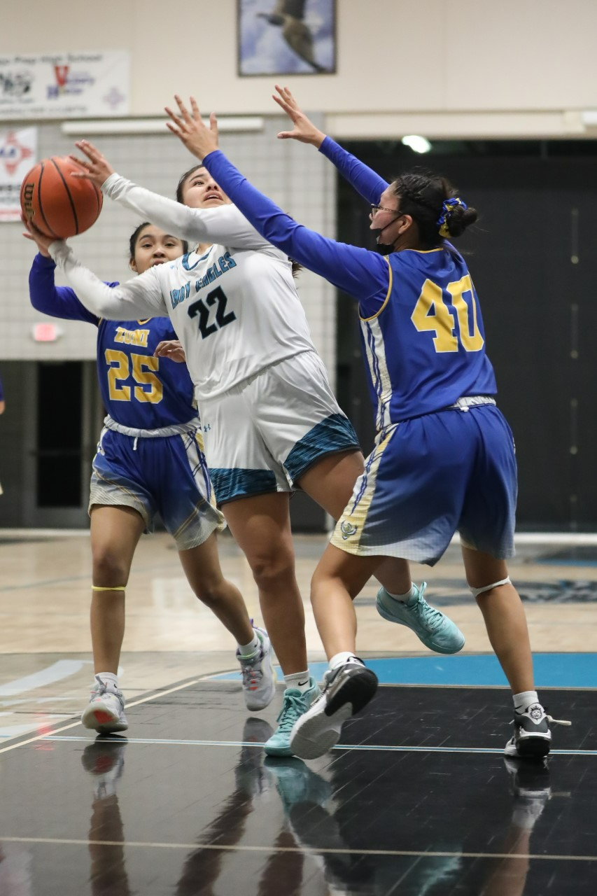 Navajo Prep's Shiloh Conn drives into the paint and shoots over Zuni's Kealani Kaamasee (40) in the fourth quarter on Wednesday, February 8, 2023 at Navajo Preparatory School.