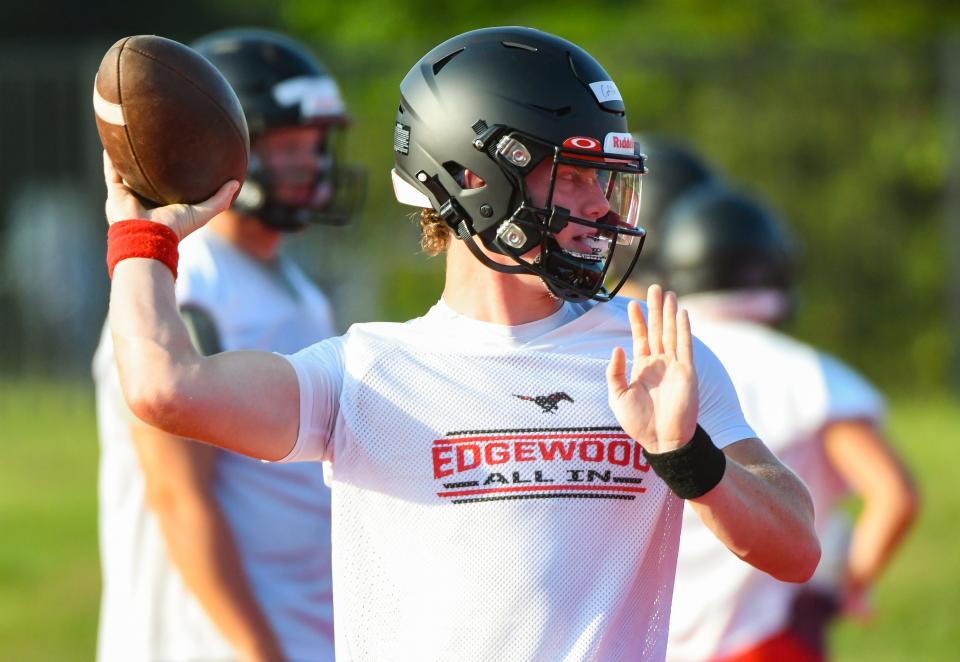 Edgewood’s Grant Coffey looks to throw a pass during the first day of football practice at Edgewood on Monday, July 31, 2023.