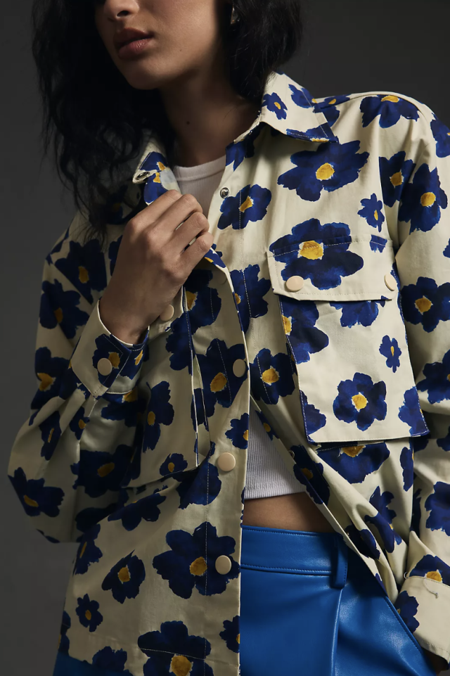 model wearing blue leather pants and white, blue, yellow Pepaloves Floral Jacket (photo via Anthropologie)