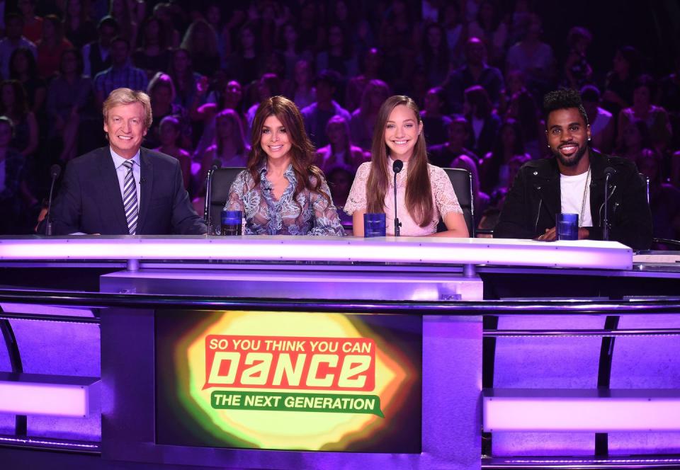 nigel lythgoe and paula abdul on panel of so you think you can dance sitting in front of a studio audience