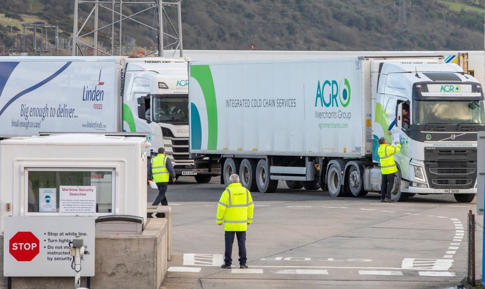 Officials check freight from Scotland as truckers disembark a ferry at the Port of Larne in County Antrim, Northern Ireland on January 1, 2021, as a new trade border between Northern Ireland and the rest of the UK began operating at 23:00 GMT on December 31, 2020. - In Northern Ireland, the border with Ireland will be closely watched to ensure movement is unrestricted - key to a 1998 peace deal that ended 30 years of violence over British rule as Britain on Friday began a new year and life outside the European Union after leaving the bloc's single market. (Photo by PAUL FAITH / AFP) (Photo by PAUL FAITH/AFP via Getty Images)