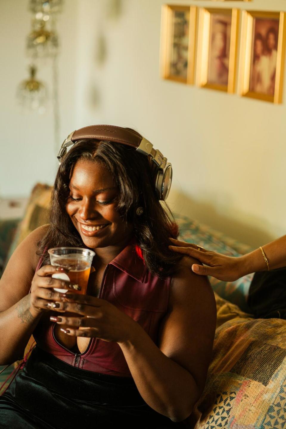 DJ Nico grins between sips of Auntie's Coffee cold brew after her set.