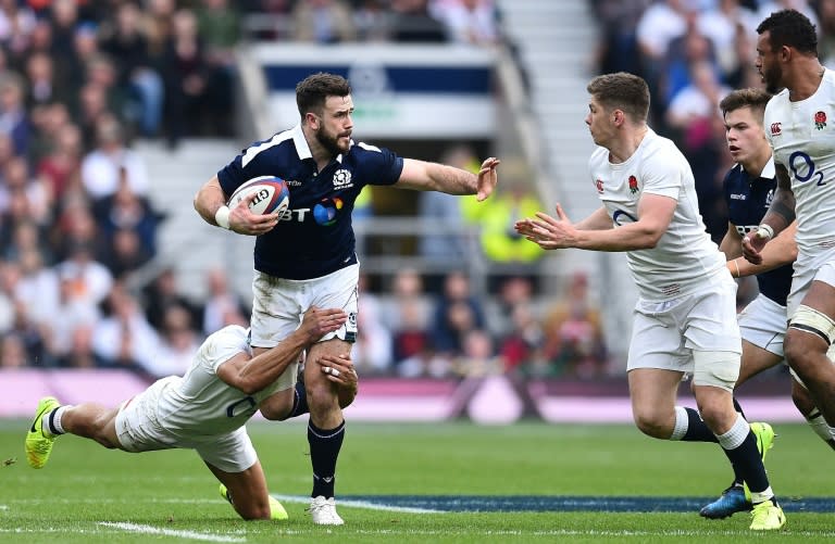 Scotland's centre Alex Dunbar (2L) is tackled by England's centre Jonathan Joseph (L) during the Six Nations international rugby union match between England and Scotland at Twickenham stadium in south west London on March 11, 2017