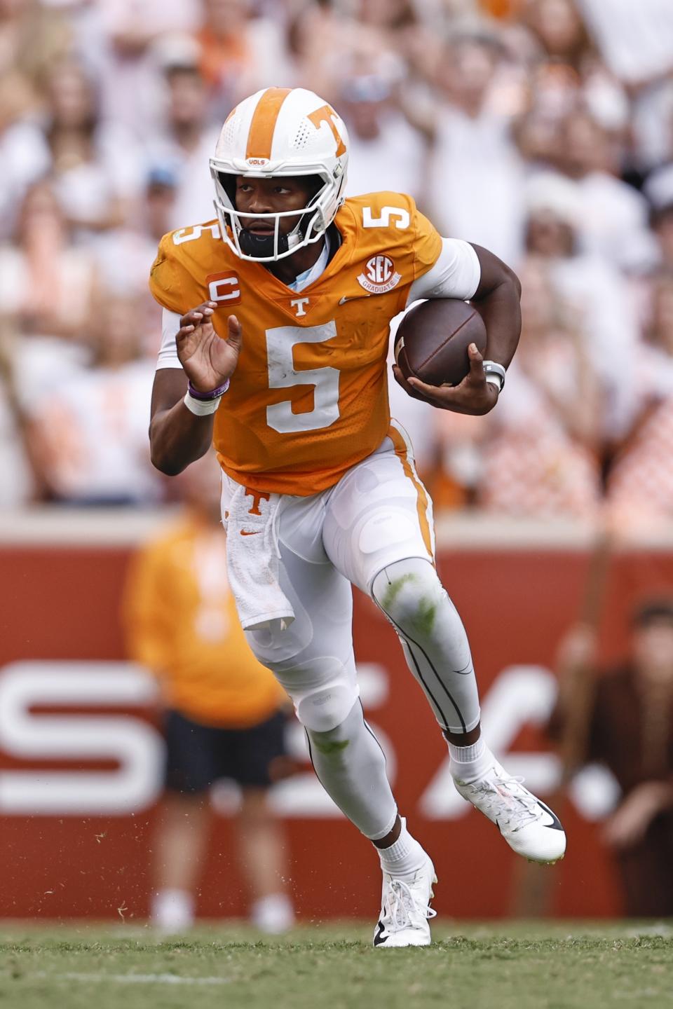 FILE - Tennessee quarterback Hendon Hooker (5) runs for yardage during the second half of an NCAA college football game against Florida, Saturday, Sept. 24, 2022, in Knoxville, Tenn. Alabama's Bryce Young, Ohio State's C.J. Stroud, Kentucky's Will Levis and Florida's Anthony Richardson all will make fan bases very happy on April 27, but the steal of the draft could end up being Tennessee's Hendon Hooker. (AP Photo/Wade Payne, File)