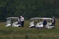 U.S. President Donald Trump participates in a round of golf at the Trump National Golf Course in Sterling, Virginia