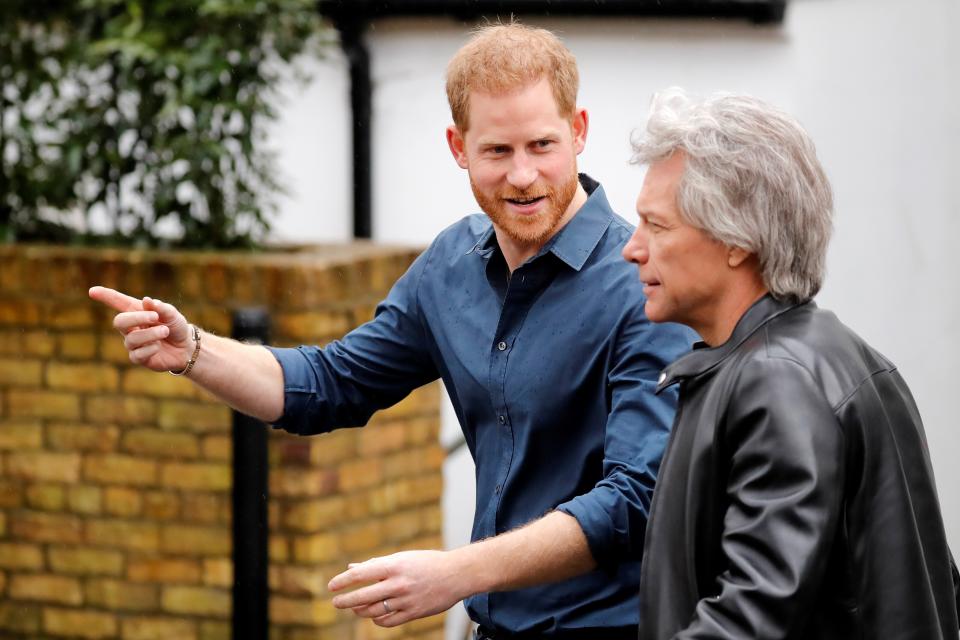 Harry and Bon Jovi, walk to recreate the famous Beatles pose on the zebra crossing outside the Abbey Road Studios. (Photo: TOLGA AKMEN via Getty Images)