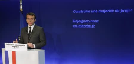 Former French minister Emmanuel Macron, head of the political movement En Marche !, or Forward !, and candidate for the 2017 French presidential election, attends a news conference at his campaign headquarters in Paris, France, January 19, 2017. REUTERS/Philippe Wojazer