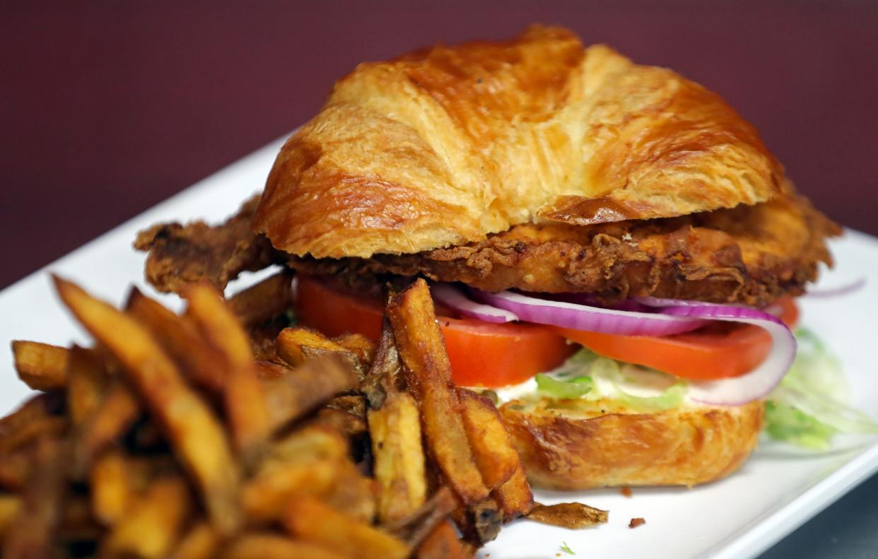 The French Chic, a deep-fried chicken breast with veggies and white French dressing on a croissant, from The Eye Opener, Wednesday, April 24, 2024, in Akron, Ohio.