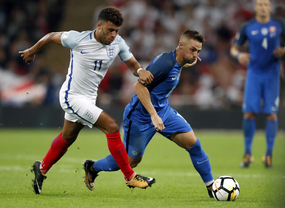 <p>England’s Alex Oblate-Chamberlain, left, and Slovakia’s Robert Mak, right, challenge for the ball during the World Cup Group F qualifying soccer match between England and Slovakia at the Wembley stadium in London, Great Britain, Monday, Sept. 4, 2017. (AP Photo/Frank Augstein) </p>