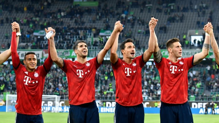 Feel-good factor: Thiago Alcantara, Javi Martinez, Mats Hummels and Niklas Suele celebrate after Saturday's win at Wolfsburg