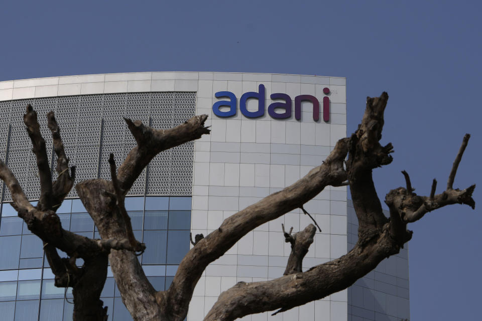 Dried branches of a tree stand outside Adani Corporate House in Ahmedabad, India, Friday, Jan. 27, 2023. Shares in India’s Adani Group plunged up to 20% on Friday and the company said it was considering legal action against U.S.-based short-selling firm Hindenburg Research for allegations of stock market manipulation and accounting fraud that have led investors to dump its stocks. (AP Photo/Ajit Solanki)