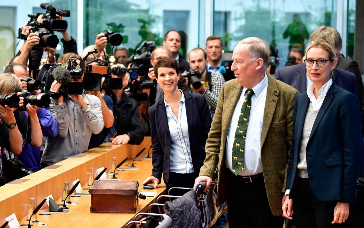 Frauke Petry (left) stunned party colleagues, including top candidates Alexander Gauland (centre) and Alice Weide (right), when she announced she would not take up the AfD party whip in parliament - AFP