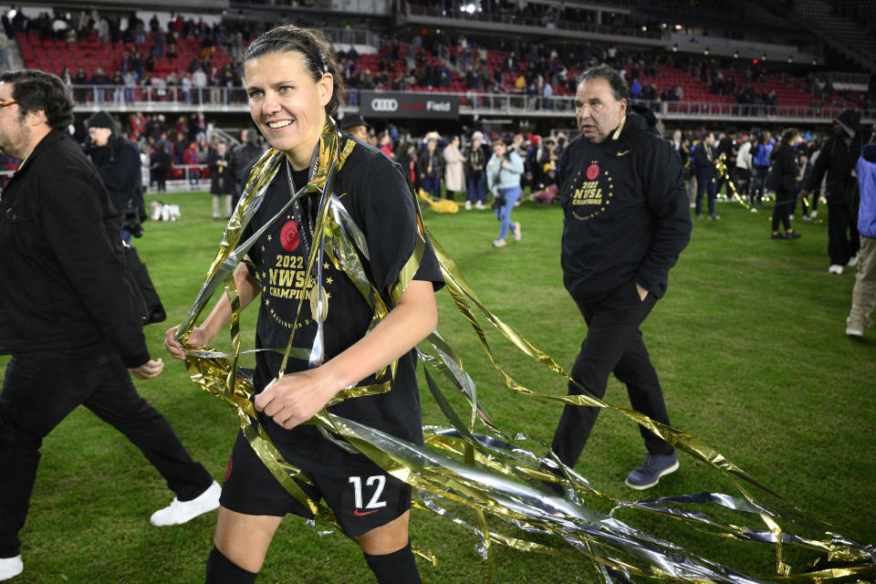 Portland Thorns FC forward Christine Sinclair (12) walks on the field with streamers after the NWSL championship soccer match against the Kansas City Current, Saturday, Oct. 29, 2022, in Washington. Portland won 2-0. (AP Photo/Nick Wass)