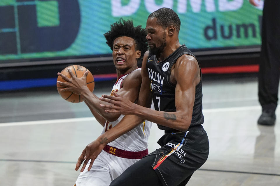 Cleveland Cavaliers' Collin Sexton (2) makes contact with Brooklyn Nets' Kevin Durant (7) during the second half of an NBA basketball game Sunday, May 16, 2021, in New York. Sexton was called for a flagrant foul and ejected from the game. (AP Photo/Frank Franklin II)