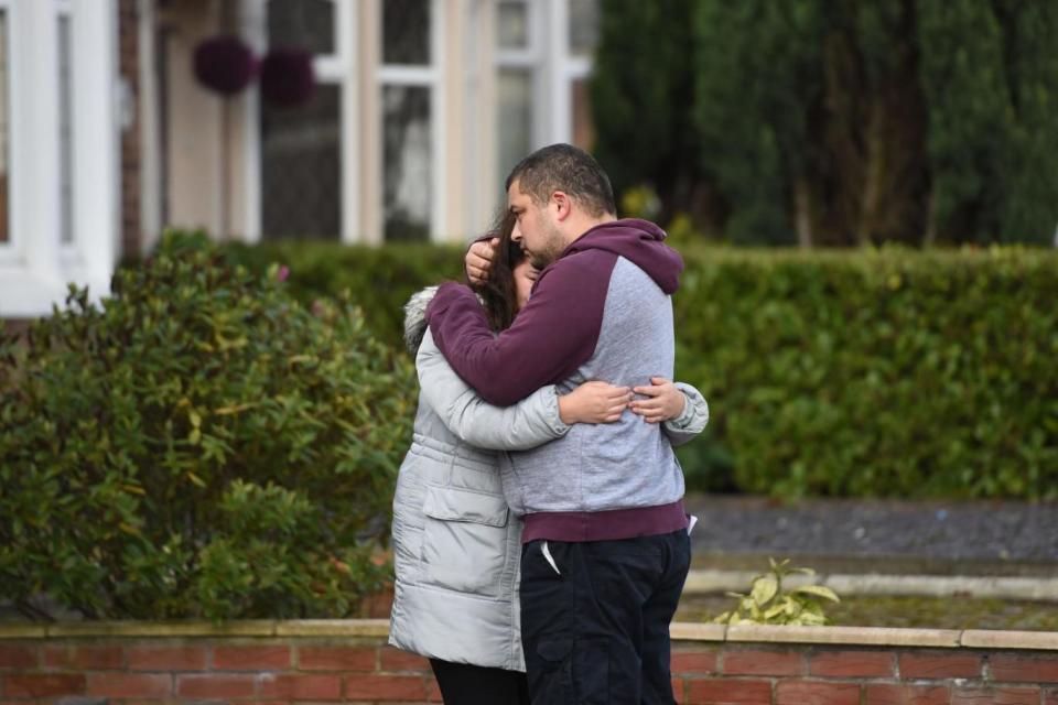 Reese Platt-May, the father of brothers Corey and Casper, hugs his sister Tia Fletcher close to the scene where the boys, aged six and two, were killed in a hit-and-run collision in Coventry (PA)