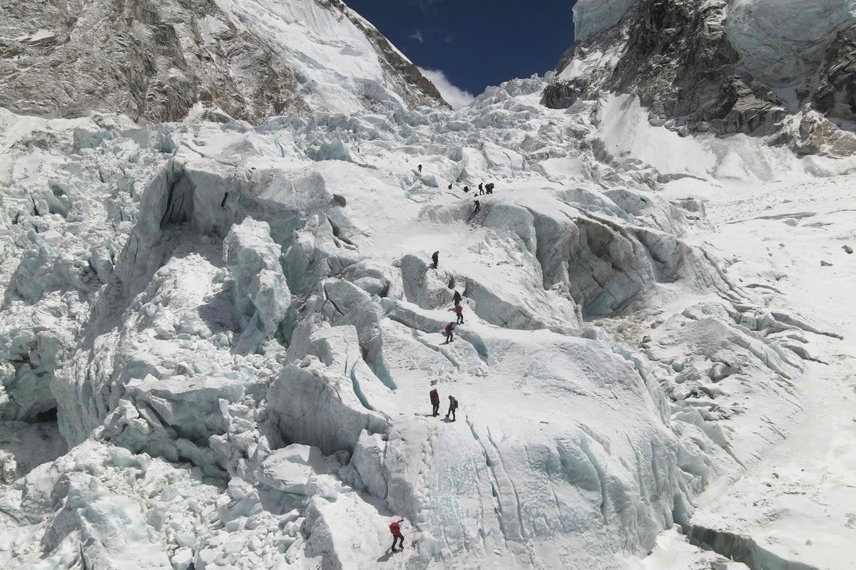 Climbers cross the Khumbu icefall of Mount Everest, as seen from the Everest Base Camp, some 140 km northeast of Kathmandu in 2021  (AFP/Getty Images)