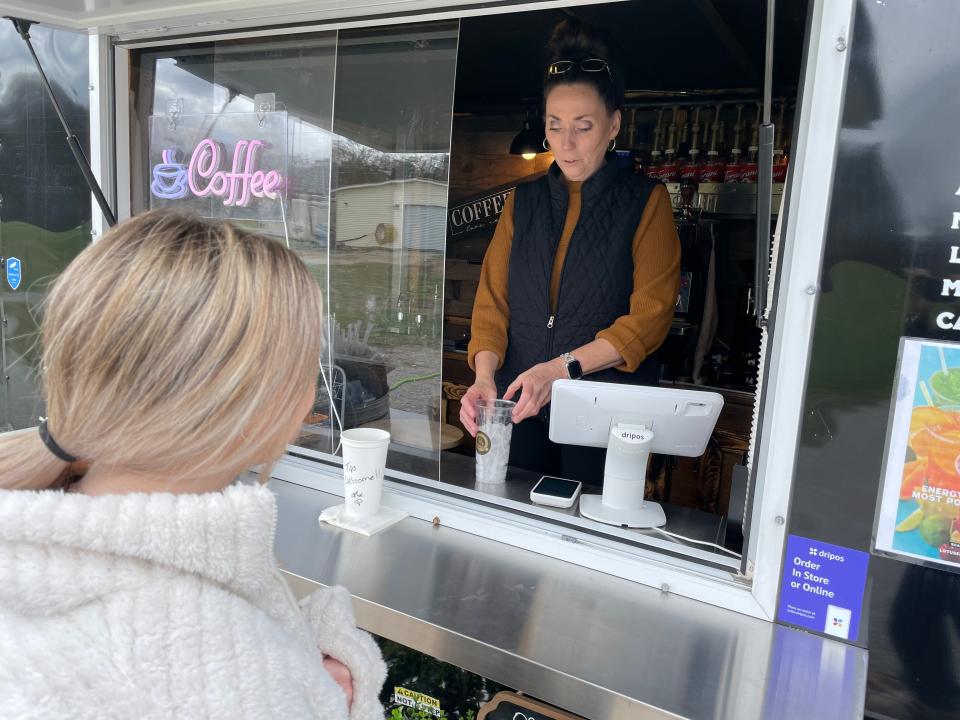 Tammy Diamond delivers on some craft coffee at Brewtopia. It's one of the new amenities at the Tennessee Tee golf driving range in Norris, Tennessee. May 2024