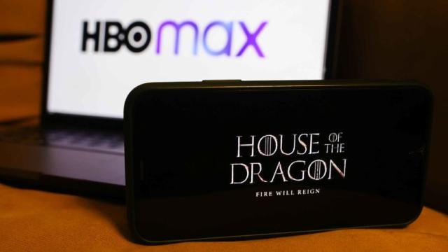 'House of the Dragon' series logo displayed on a phone screen and HBO Max logo displayed on a laptop screen are seen in this illustration photo taken in Poland on August 16, 2022.