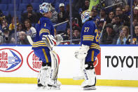 Buffalo Sabres goaltender Ukko-Pekka Luukkonen (1) comes off the ice and is replaced by goaltender Devon Levi (27) during the first period of an NHL hockey game against the Ottawa Senators Wednesday, March 27, 2024, in Buffalo, N.Y. (AP Photo/Jeffrey T. Barnes)