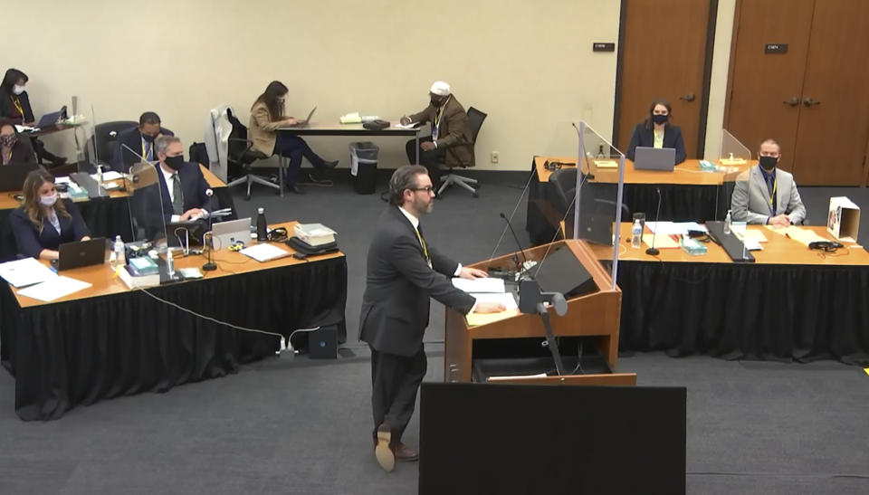 In this screen grab from video, defense attorney Eric Nelson, center, listens as Hennepin County Judge Peter Cahill presides over jury selection in the trial of former Minneapolis police officer Derek Chauvin, Wednesday, March 17, 2021 at the Hennepin County Courthouse in Minneapolis, Minn. Chauvin is charged in the May 25, 2020 death of George Floyd. (Court TV, via AP, Pool)