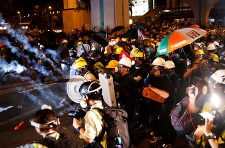 Anti-extradition demonstrators hold makeshift shields, after a march to call for democratic reforms in Hong Kong