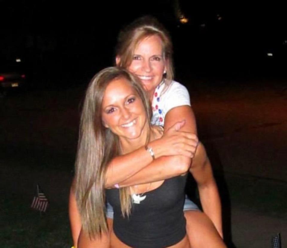 Kyndra Smith gives a piggyback ride to her mother Terri Jensen in July 2012 in Nebraska.