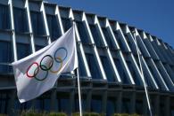 The Olympic flag flutters outside the International Olympic Committee (IOC) in Lausanne