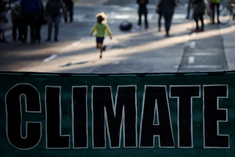 FILE PHOTO: Climate change activists gather to protest outside of BlackRock headquarters, in San Francisco