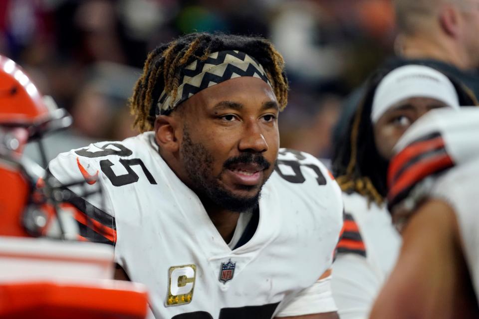 Cleveland Browns defensive end Myles Garrett sits on the bench during the first half of an NFL football game against the Buffalo Bills, Sunday, Nov. 20, 2022, in Detroit. (AP Photo/Paul Sancya)