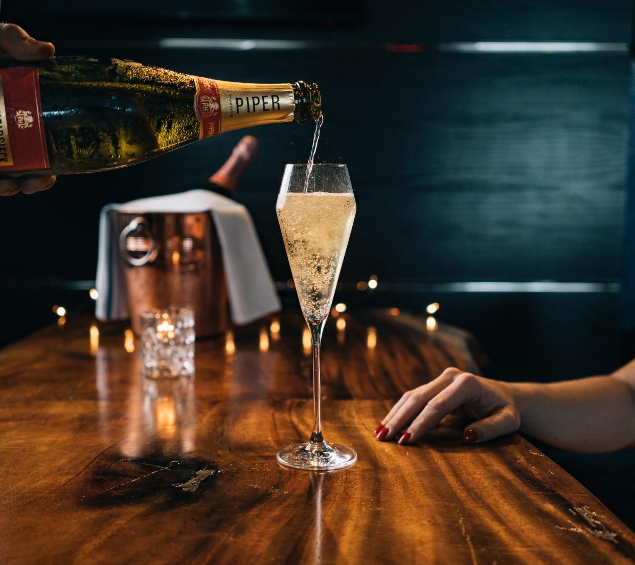 NYE sparkle: A glass of Champagne is served at 1000 North restaurant in Jupiter.