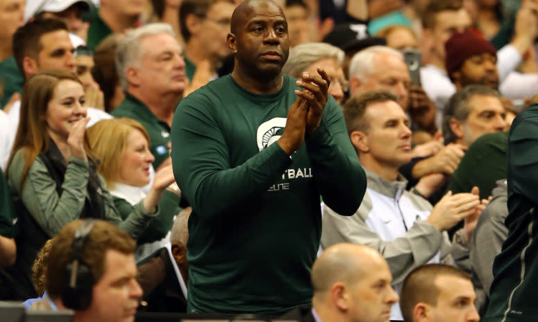 Magic Johnson cheers on the Spartans.