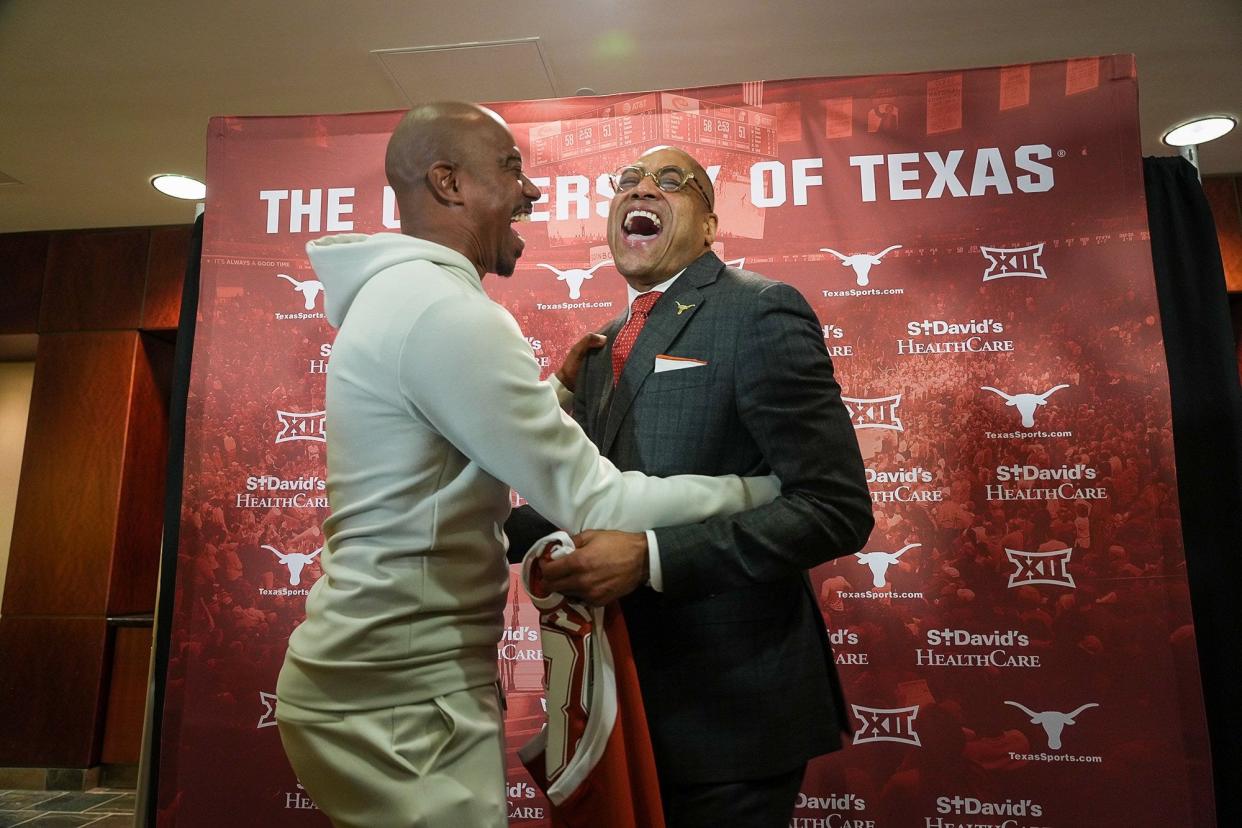 Rodney Terry, right, and former Longhorn TJ Ford share a joyful moment at Terry's introduction as Texas' full-time head coach last spring. Terry says Ford opened the recruiting pipeline from Houston to Austin, and the UT coach wants to make recruiting Houston a priority again.