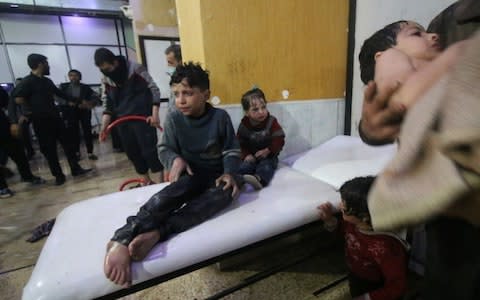 Affected Syrian kids wait to receive medical treatment after Assad regime forces allegedly conducted poisonous gas attack to Duma town of Eastern Ghouta in Damascus - Credit: Getty