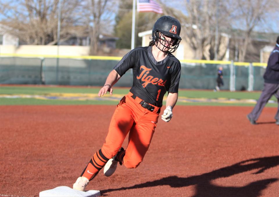Aztec High School's Reagan Bradshaw rounds third and heads home to score a run in the top of the first inning of a game against Bloomfield, Tuesday, March 22, 2022 at Bloomfield High School