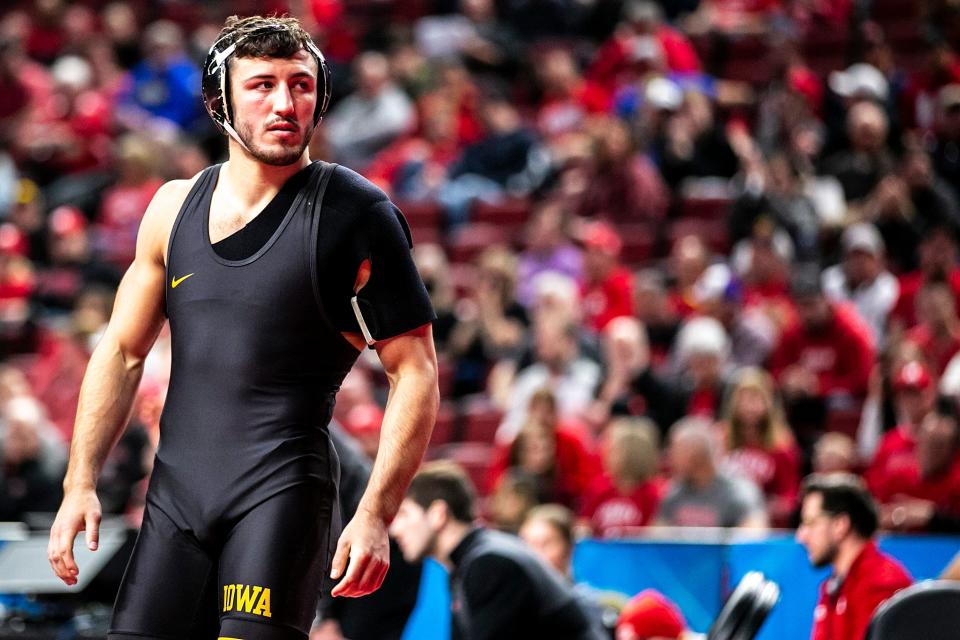 Iowa's Michael Kemerer is introduced before wrestling at 174 pounds during the first session Saturday of the Big Ten Wrestling Championships.