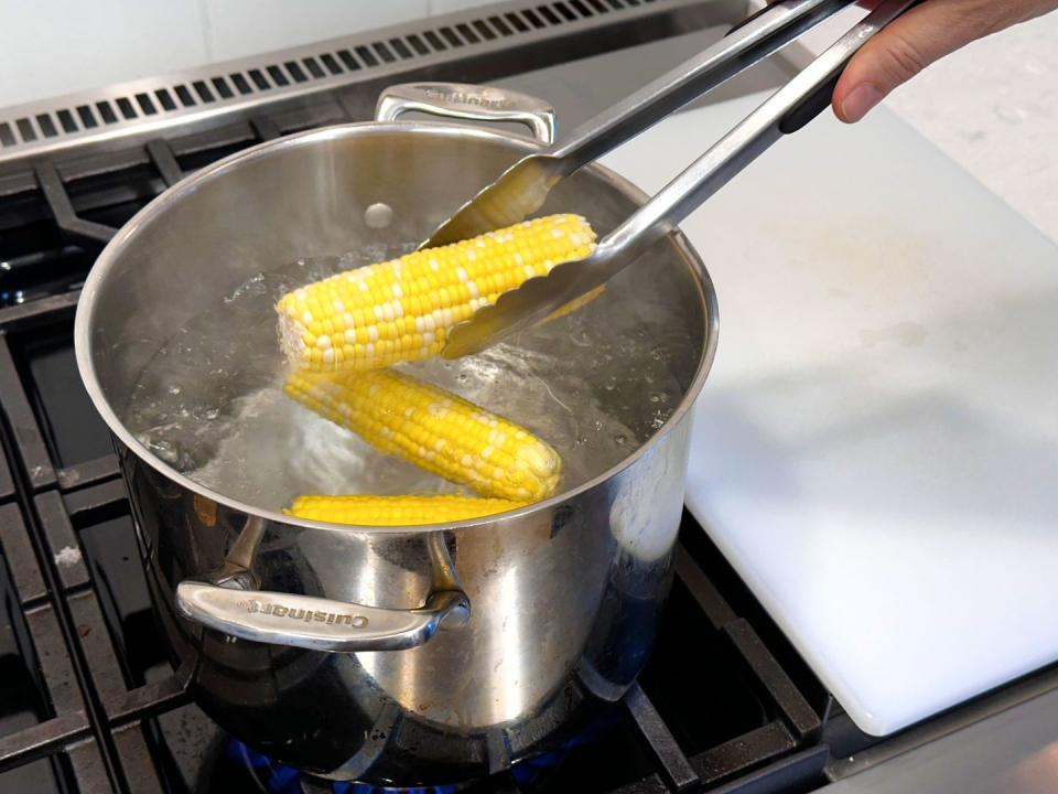 a person cooking food in a pot