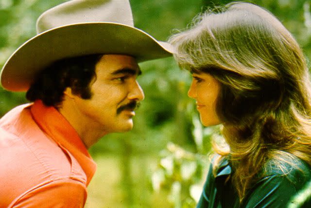 <p>Michael Ochs Archives/Getty Images</p> Burt Reynolds and Sally Field in the film 'Smokey and the Bandit'.