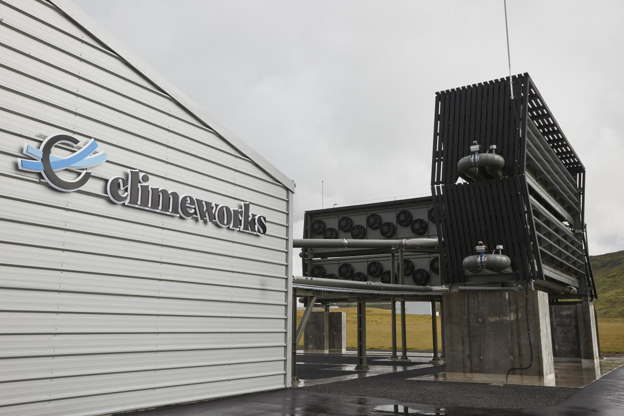 Collector containers at Climeworks' Orca direct air capture and storage facility under a gray sky.