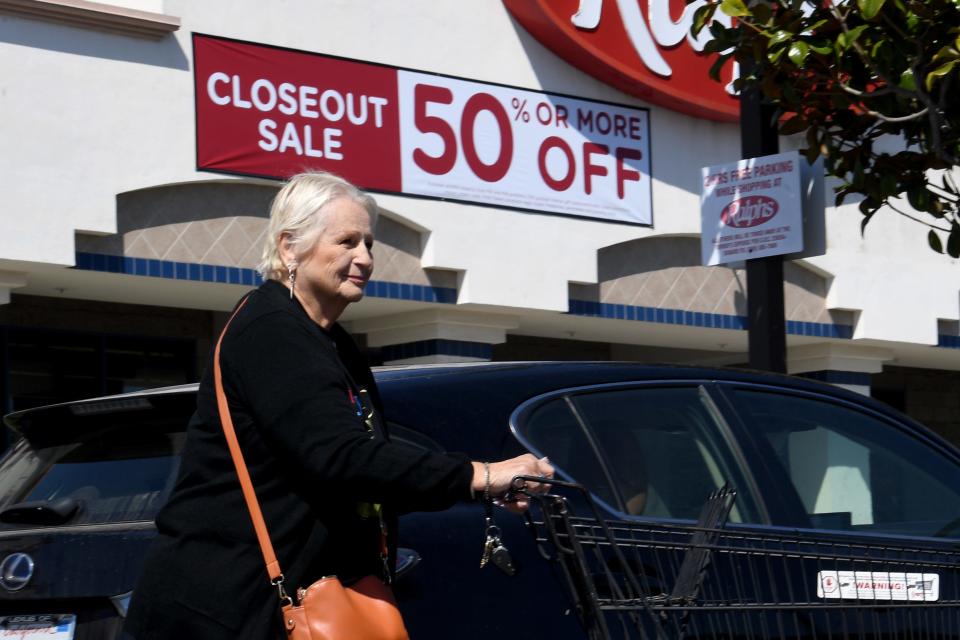 Eve O'Neill, 79, of Oxnard, pushes a shopping cart after buying groceries at Ralphs on Saviers Road in Oxnard on Tuesday. The store will close in June.