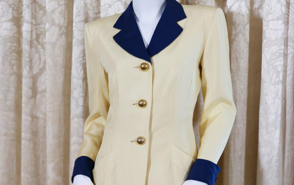 A 1989 Hong Kong royal tour Catherine Walker yellow and navy skirt suit worn by Princess Diana was on display
