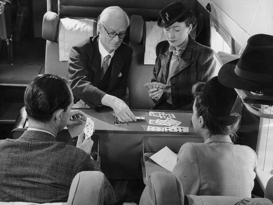 Passengers in a BEA Vickers Viking play a game of cards in 1947.